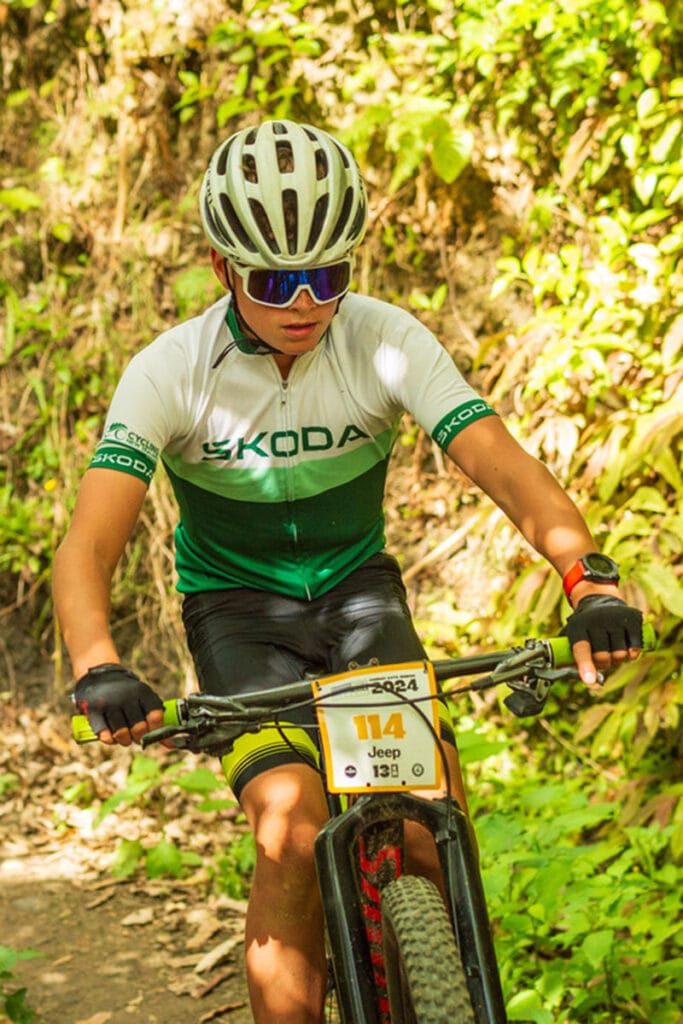 A young mountain biker riding in the Arapuke Classic race.